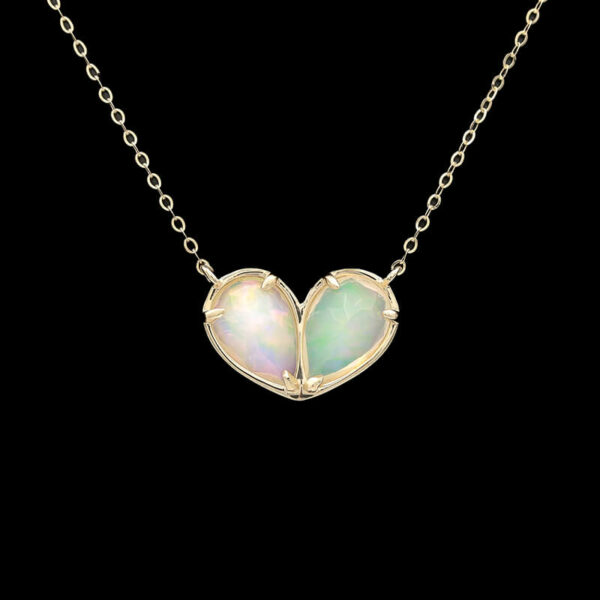 two white opalite hearts on a gold chain