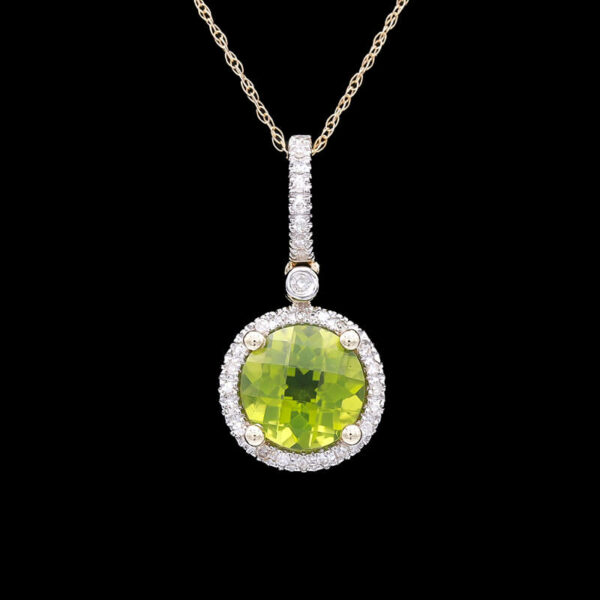 a yellow and white diamond pendant with an oval shape