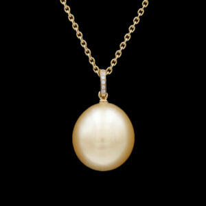 a pearl and diamond pendant on a gold chain