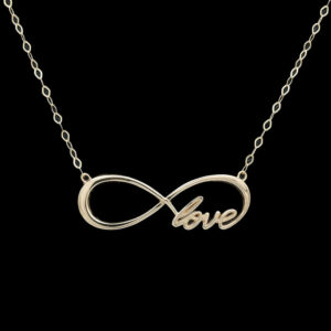 a gold necklace with the word love on it
