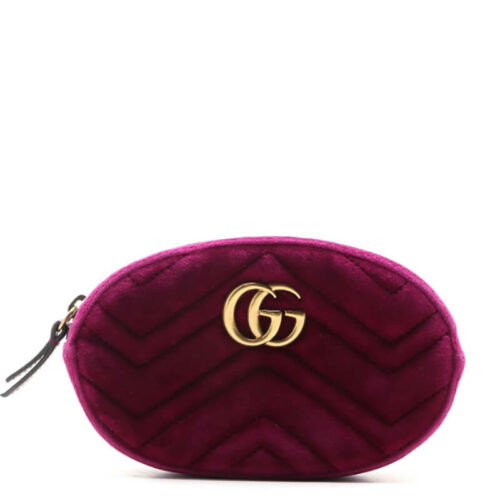a small purple purse with a gold g on it