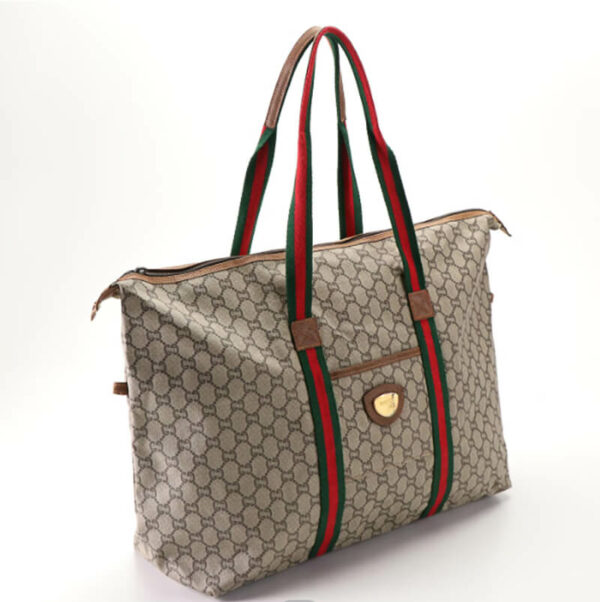a handbag with a red and green stripe on it