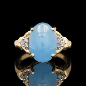 an oval blue jade and diamond ring