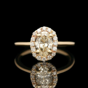 a fancy yellow diamond ring with diamonds around it