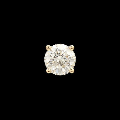 a round diamond in yellow gold on a black background