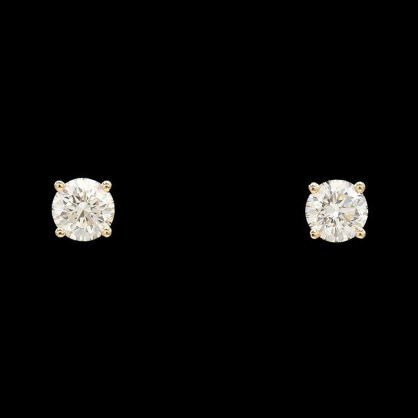 a pair of diamond stud earrings