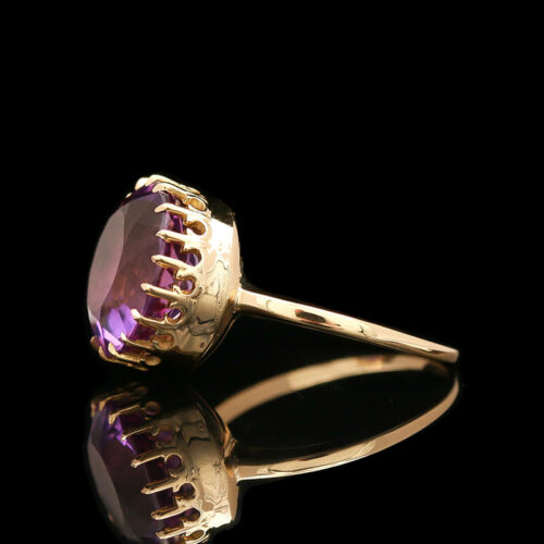 a gold ring with an amethorate stone