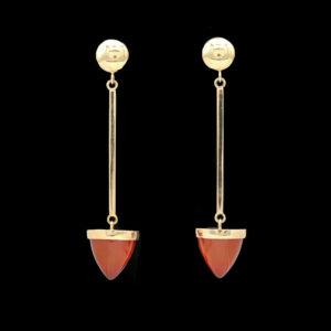 a pair of gold and red earrings