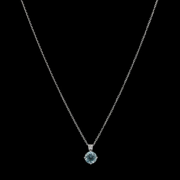a blue topazte pendant on a silver chain