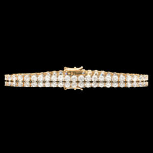 a gold bracelet with rows of diamonds