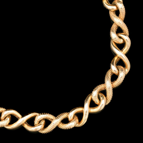 a gold chain with an intricate design on it