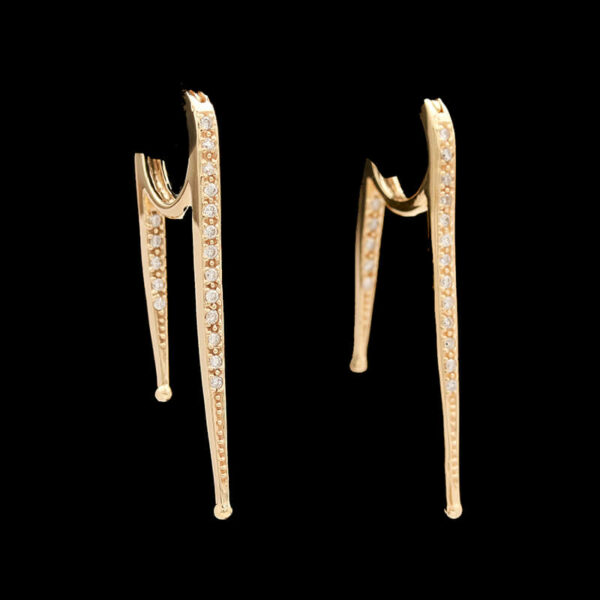 a pair of gold earrings with diamonds on them