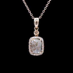 a necklace with a square shaped stone and diamonds