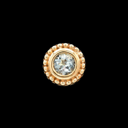a gold ring with a white diamond in the center
