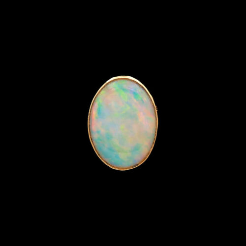 a white opal in a gold setting