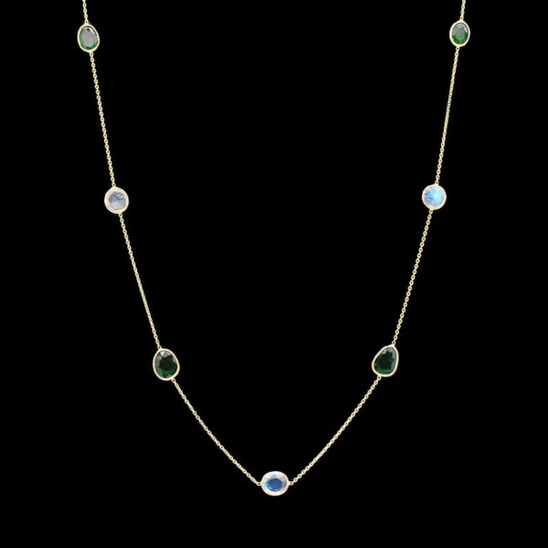 a necklace with green and white stones