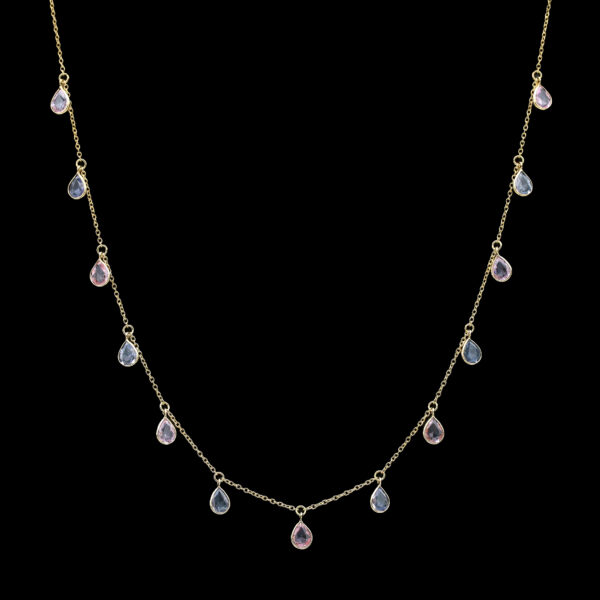 a gold necklace with multi colored stones