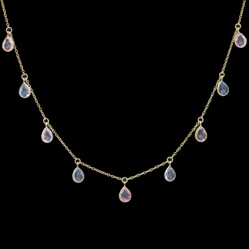 a gold necklace with pink and blue stones