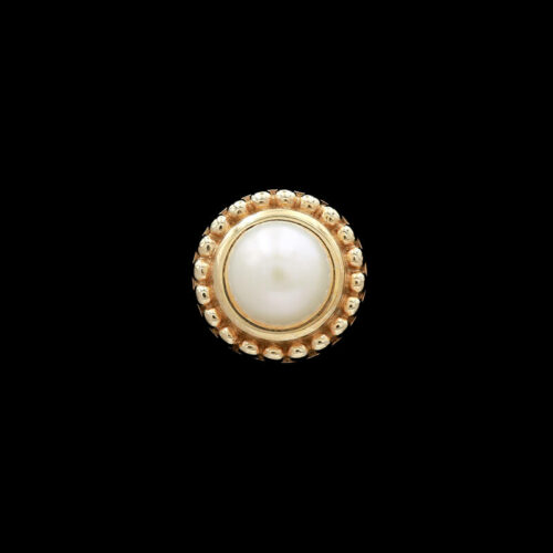 a white pearl and gold ring