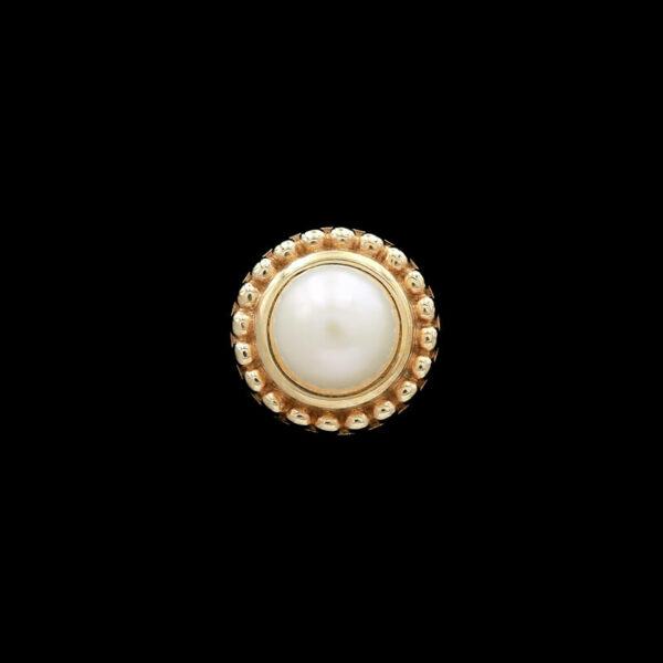 a white pearl and gold ring