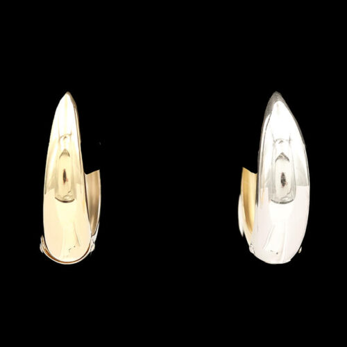 two silver and gold rings with a black background