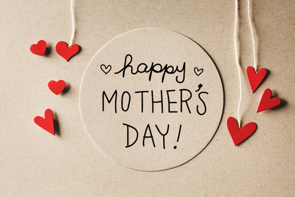 a mother's day card with hearts on it