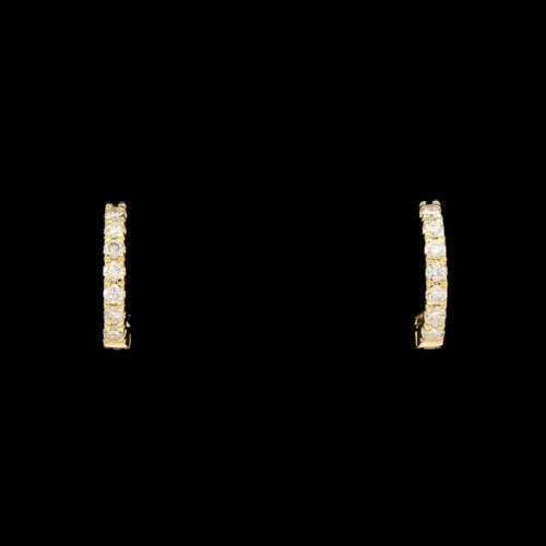 a pair of yellow gold earrings with small diamonds