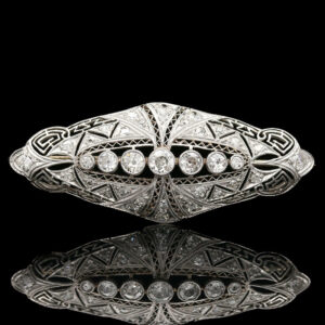 an art deco ring with diamonds on it