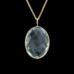 a necklace with a large blue stone in the center