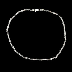 a silver chain bracelet on a black background