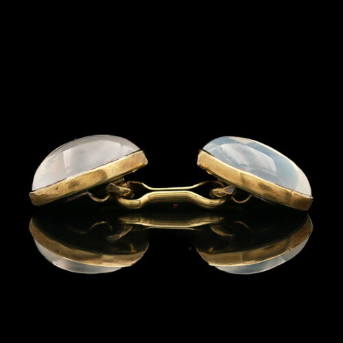 two gold cufflinks with mother of pearl