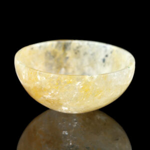 a marble bowl sitting on top of a table