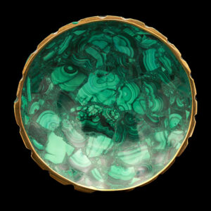 a green glass bowl with gold trim