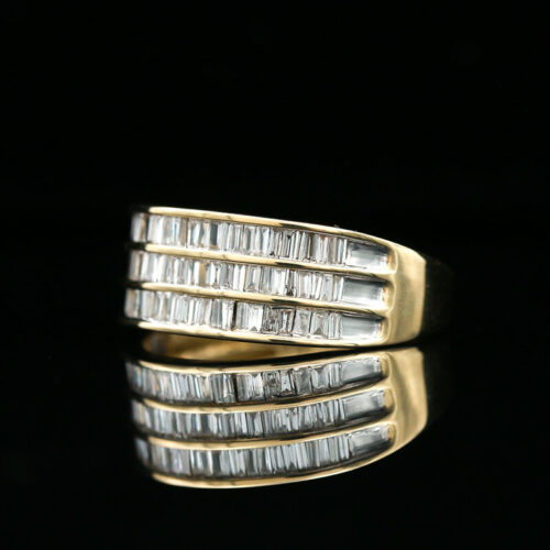 two gold rings with baguettes and diamonds