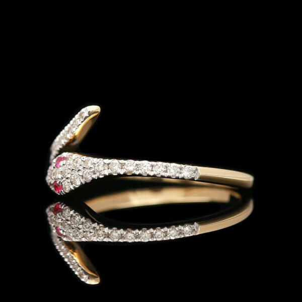 a diamond and ruby ring on a black background