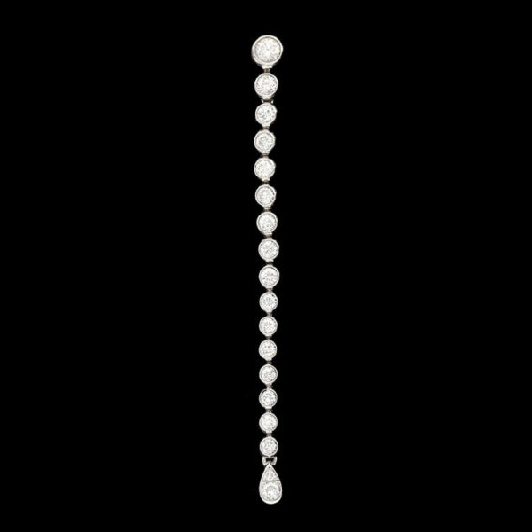 a long diamond necklace on a black background