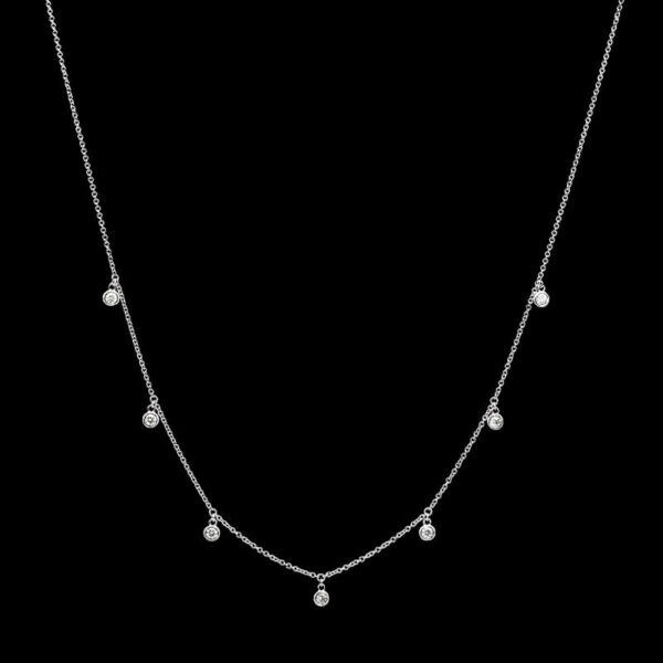a white gold necklace with five diamonds