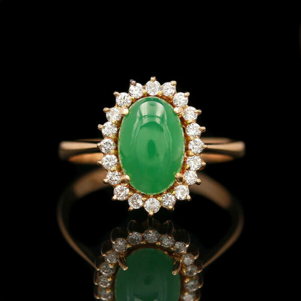 an oval shaped jade and diamond ring