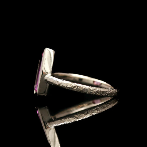 a silver ring with an amethorate stone in it
