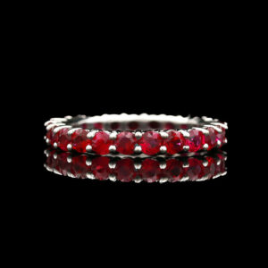 a ring with red stones on it