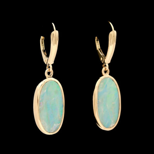 a pair of gold earrings with opal stones