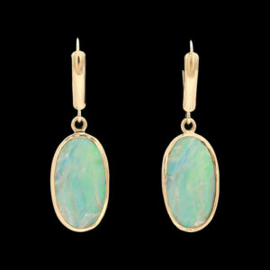 a pair of earrings with an oval shaped opalite