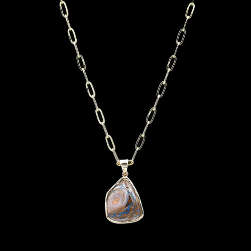 a necklace with a pendant that has a shell on it