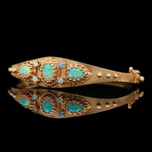 an old gold bracelet with opal stones