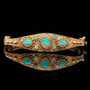 an old gold bracelet with opal stones