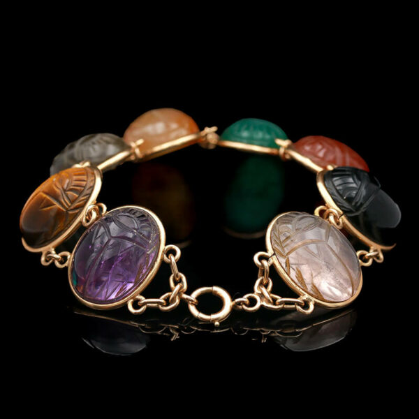 a bracelet with different colored stones on it