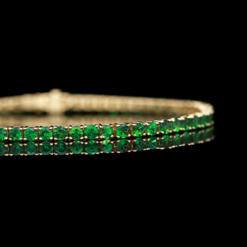 a bracelet with green beads on it