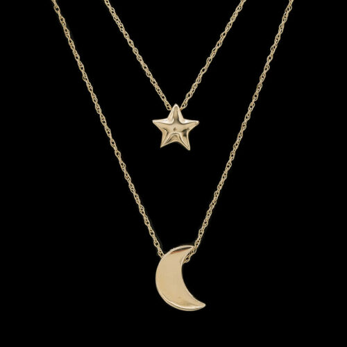 two gold necklaces with stars on them