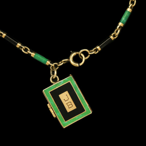 a green and black necklace with a gold chain