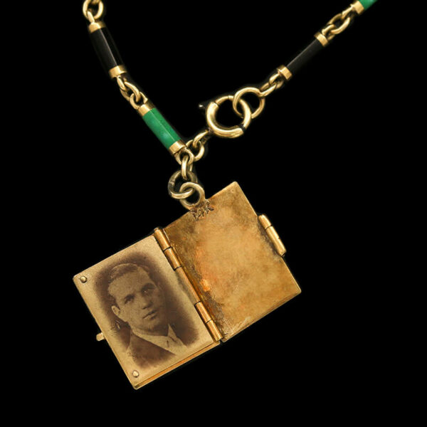 an old photo is attached to a chain